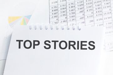 Top stories text message on notepad background