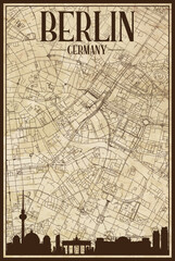 Black printout streets network map with city skyline of the downtown BERLIN, GERMANY on a vintage paper framed background
