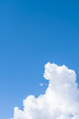 White clouds in the blue sky.