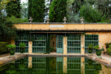 Greenhouse and Pool in the French garden. Jardin Serre de la Madone, with rare plantings. Summer....