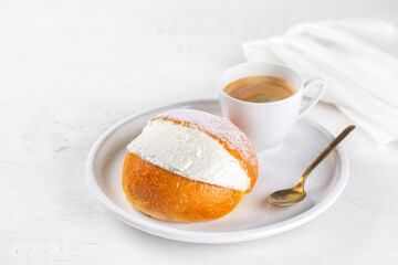 The Maritozzo and espresso coffee. Classic sweet italian pastry, packed full of whipped cream. The...