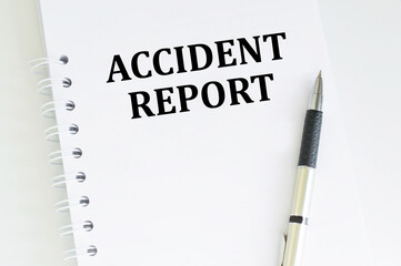 Business and finance. A notebook with the inscription - Accident report