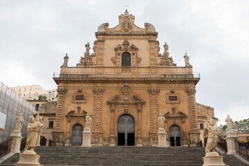 Fototapeta na wymiar Facade of the basilica of San Pietro, a religious building in Modica, in the province of Ragusa, Italy. This church is considered a masterpiece of the Italian Baroque.