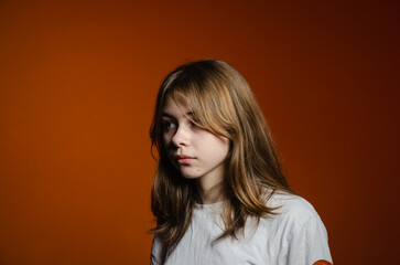 portrait of a girl in a white T-shirt on a dark background