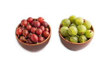 Fresh red and green gooseberry in clay bowl isolated on white, side view.