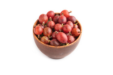 Fresh red gooseberry in clay bowl isolated on white, side view.