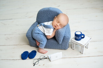 Portrait Of Cute Baby Boy Sitting On Table - obrazy, fototapety, plakaty