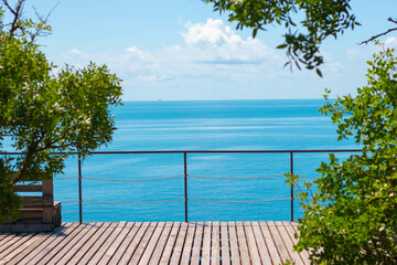 Fototapeta na wymiar view of the blue sea from the wooden veranda