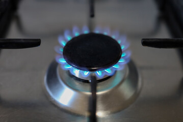 Close-up of a flame of methane gas stove in a domestic kitchen