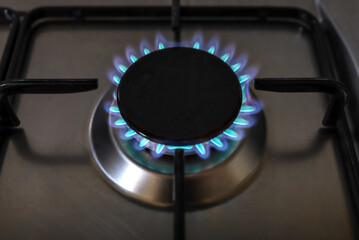 Close-up of a flame of methane gas stove in a domestic kitchen