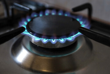 Close-up of a flame of methane gas stove in a domestic kitchen