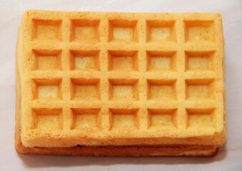 square baked sweet fluted Belgian waffles on a gray marble background