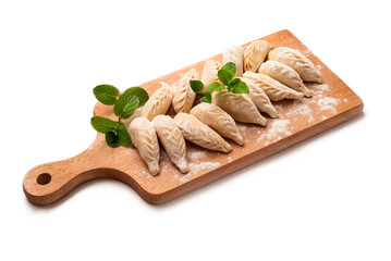 Tagliere con culurgionis ogliastrini freschi, tipici ravioli sardi ripieni di patate, pecorino e...