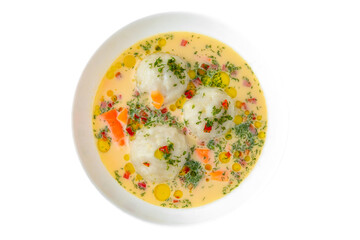 Fragrant first course with chicken broth, cream and meatballs. Dietary cream soup based on baked and fresh vegetables with herbs. Fitness menu. Delivery of prepared food. White background