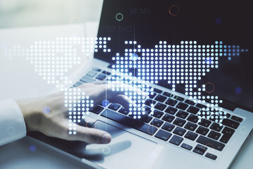 Naklejka premium Multi exposure of abstract graphic world map and hands typing on computer keyboard on background, big data and networking concept