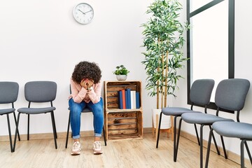 Young middle east woman desperate sitting on chair at waiting room