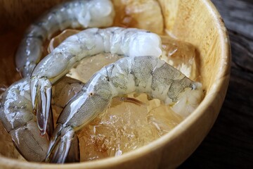 Fresh shrimp raw seafood on wood background
