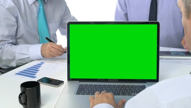 green screen laptop on business meeting