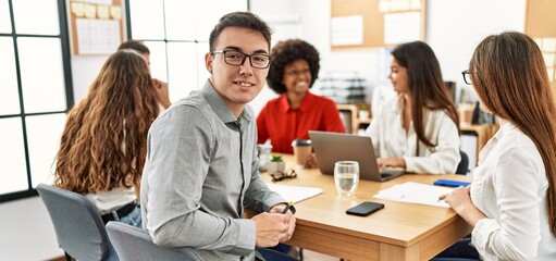 Obraz premium Group of business workers smiling happy working at the office.