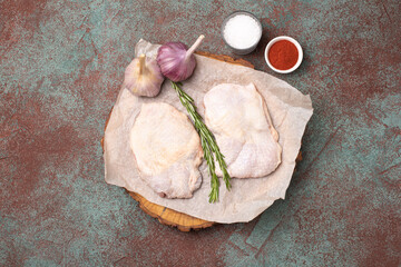 Chicken breast, raw chicken breast, on a textured background