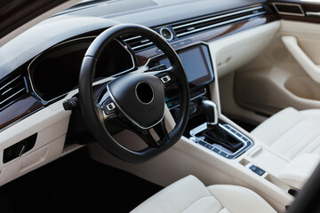 Steering wheel in a luxury modern car interior.