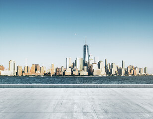 Empty concrete dirty seafront on the background of a beautiful New York city skyline at daytime,...