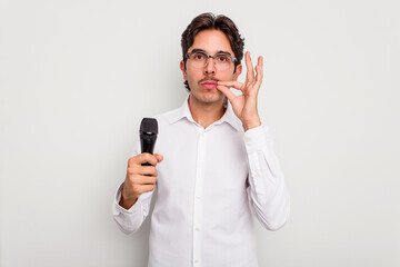 Young hispanic singer man isolated on white background with fingers on lips keeping a secret.