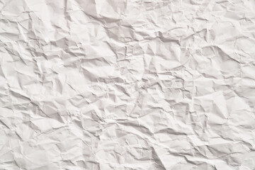 White crumpled paper texture with wrinkles. Damaged and torn sheet