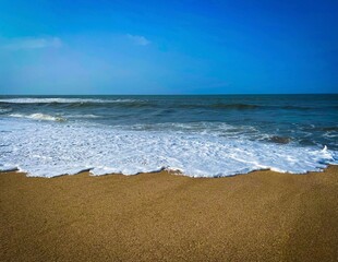 Beach and sea. Beautiful ocean water, sea blue, sky, clouds, sand, art, abstract, texture, pattern, background, wallpaper, backdrop. Summer holiday vacation background. Natural abstract wallpaper.