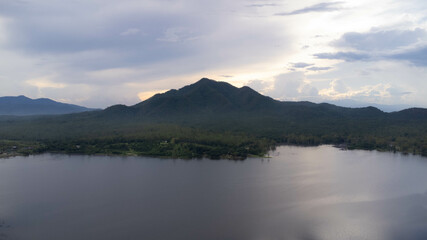 Fototapeta na wymiar Aerial view of reservoir on tropical mountain background at sunset in northern Thailand. Beautiful landscape nature background.