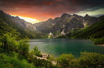 Amazing sunset in the Tatra Mountains above Eye of the Sea Lake, Poland - obrazy, fototapety, plakaty