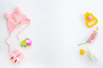 Baby girl pink hat with booties and accessories, top view