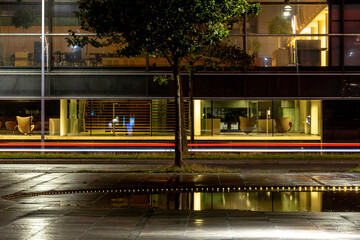 Fototapeta premium Copenhagen, Denmark Car streaks at night on Kalvebod Brygge in downtown.also known as the Under krystallen plaza.