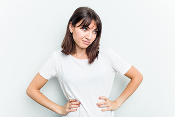 Young caucasian woman isolated on white background confused, feels doubtful and unsure.