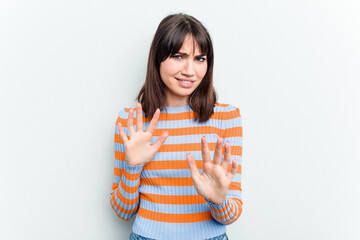 Young caucasian woman isolated on white background rejecting someone showing a gesture of disgust.