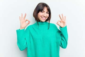Young caucasian woman isolated on white background cheerful and confident showing ok gesture.
