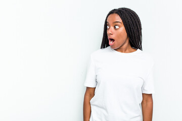 Young African American woman isolated on white background being shocked because of something she...