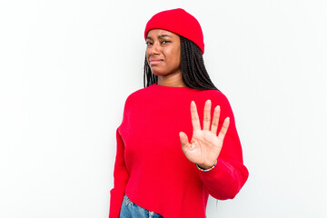 Young African American woman isolated on white background rejecting someone showing a gesture of...
