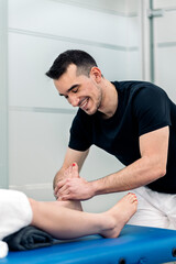 Physiotherapist Massaging Woman's Feet