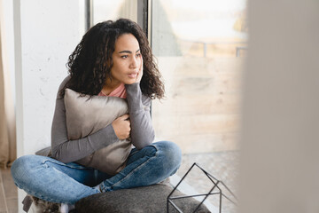 Depressed pensive thoughtful african young woman housewife suffering from periods pain headache...