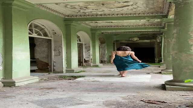 Woman walking in abandoned building