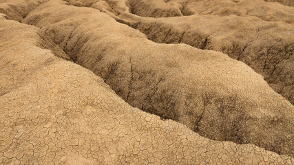 Aerial view of a geological and botanical reservation with mud volcanoes on a sunny day.