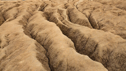 Aerial view of a geological and botanical reservation with mud volcanoes on a sunny day.