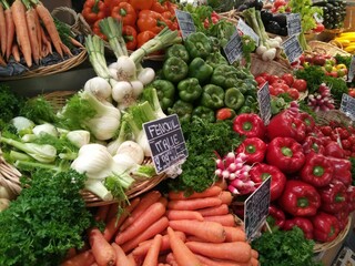 Fresh vegetables at a farmers market in France in summer, fennel, carrots, bell pepper