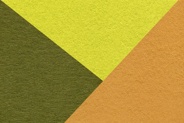 Texture of craft yellow, green and ocher shade color paper background, macro. Vintage abstract...