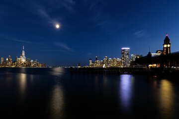 Fototapeta na wymiar View of Hoboken, NJ Transit Terminal, and skyline of Manhattan at night. High-quality photo