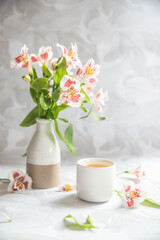 flower and herb tea in a tea cup on neutral background with space for your text. Morning tea. High quality photo