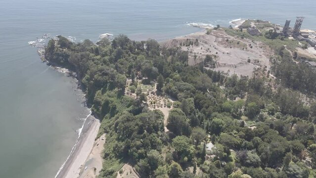 aerial drone view of Lota Park in Bio-Bio region, Chile.  park with weathered and worn buildings and structures on a coast. 4K videos.