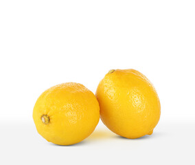 two ripe lemons side by side