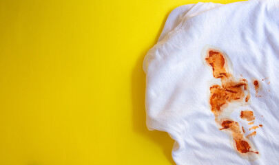 Food stains on white t shirt. Top view, copy space.
